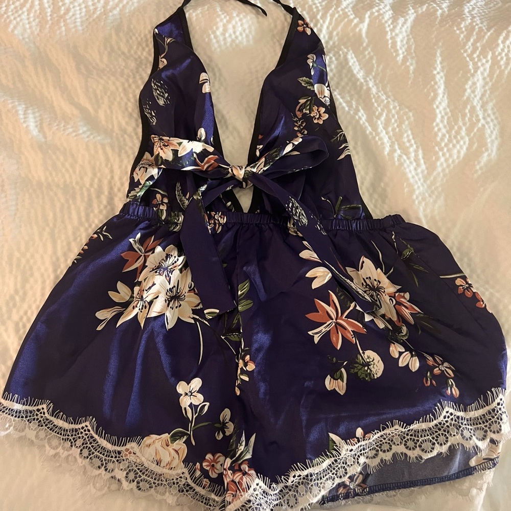 Blue satin floral romper with lace trim